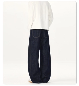 Rear view of dark blue wide-leg denim jeans with silhouette cut and minimalist pockets