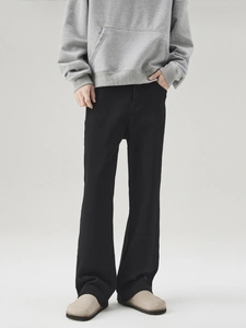Classic American high street black flared denim jeans for men with a slim fit and stretch
