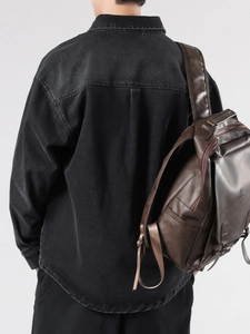Men's retro dark brown matte leather backpack with flap closure and buckle straps