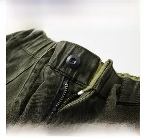 Detail of olive green cargo pants featuring elastic waist and frayed edge design