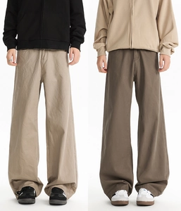 Detail of khaki and coffee brown wide-leg straight trousers in high-quality twill cotton