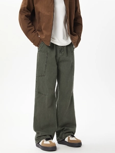 Detail of multi-pocket loose cargo pants in washed gray-green for cleanfit style