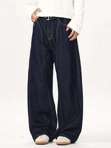 Baggy deep blue denim trousers with vertical stitching and cocoon-shaped wide leg cut
