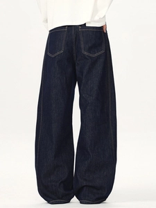Back view of wide-leg indigo denim pants with contrast stitching and oversized pockets