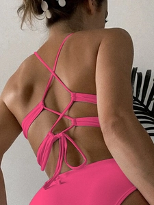 Pink criss-cross back tie sports bikini top with adjustable straps and open back design