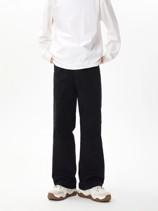 Detail of black straight-leg cargo pants with multi-pocket design and heavy cotton texture