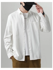 Detail of white cotton shirt texture with chest pocket and classic button-down front