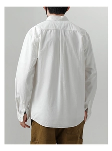 Rear view of white cotton casual shirt for men showing back pleat and curved hem