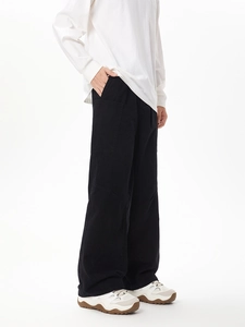 Side view of black cargo pants featuring large utility pockets and a relaxed straight fit