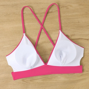 Detail of cross-back bikini top with pink straps and removable round breast pads