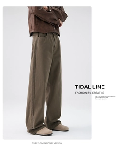 Detail view of brown wide-leg straight trousers with 3D tailoring and premium heavy fabric