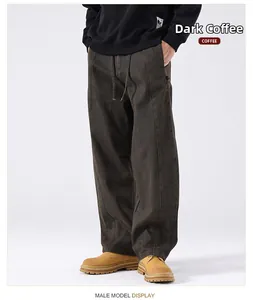 Detail of heavy cotton loose-fit cargo pants in coffee brown with drawstring waist