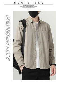 Detail view of khaki cotton long sleeve button-down shirt with a single chest pocket