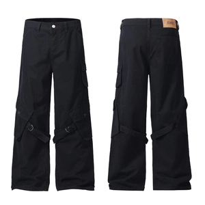 Black loose cargo pants with vintage utility pockets and yellow leather logo patch