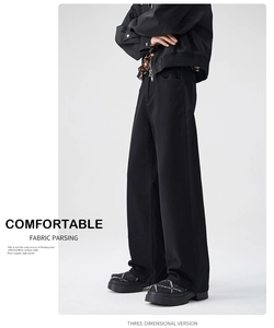 Three-dimensional cutting detail of black wide-leg trousers with high-quality fabric texture