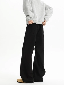 Macro side view showing the drape and clean fit of black straight leg casual trousers