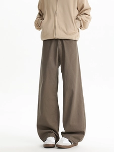 Detail view of coffee brown straight-leg cotton trousers with a cleanfit urban silhouette