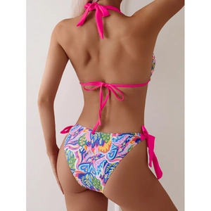 Vibrant abstract print bikini set with halter neck and side tie bottoms shown from the back