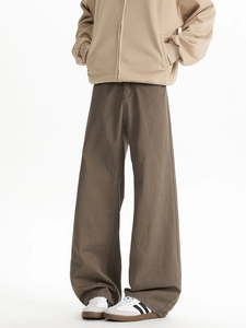 Detail of high street micro-flare trousers in khaki with a premium cotton twill texture