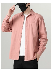 Close-up of men's casual long sleeve cotton shirt in dusty pink with chest pocket detail