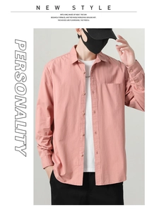 Detail of premium cotton long sleeve shirt showing fabric texture and chest pocket