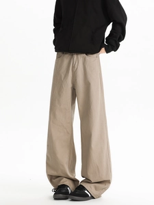 Detail view of khaki wide-leg casual pants showing twill cotton texture and straight fit cut