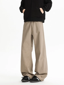 Lower body shot of men's khaki wide-leg trousers in heavy cotton twill fabric