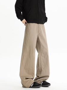 Detail view of khaki wide-leg casual pants showing premium twill fabric and high-waist cut