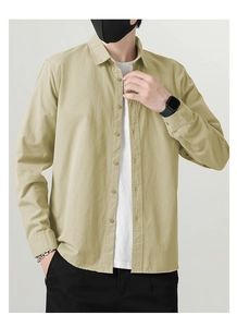 Detailed macro view of the premium cotton shirt fabric and button closure details