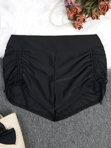 Plus size women black high waisted swim shorts with side drawstring ruching detail