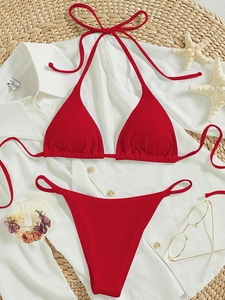 Two-piece red ribbed bikini set with halter triangle top and high-cut bottoms