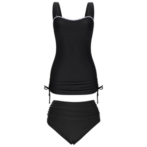 Detail of black tankini top with white scalloped lace trim and adjustable side drawstrings