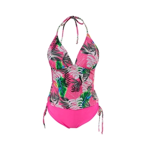 Detail of tropical palm leaf print tankini with halter neck and side tie bikini bottom