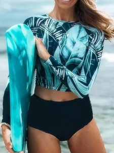 Two-piece long sleeve sun protection swimsuit with tropical leaf print and high waist bottoms