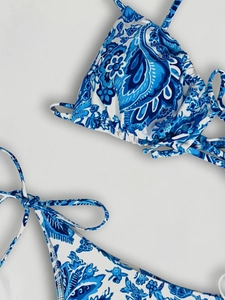 Blue paisley floral bikini set with halter neck top and side-tie bottoms for women