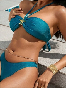 Peacock blue halter bikini with shimmering fabric and a golden starfish decoration