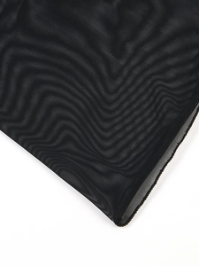 Close-up of black breathable mesh fabric texture for plus size women's beach cover-up