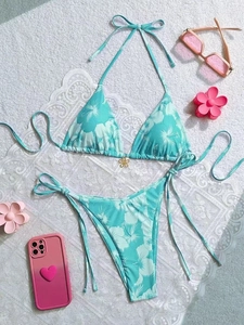 Green floral print bikini set with halter top and side-tie bottoms for beach vacation