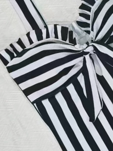 Striped one-piece swimsuit for women with ruffle trim and center bow detail on the chest