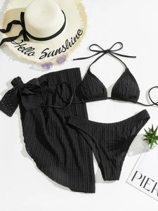 Detailed view of black three-piece bikini set with sheer texture and matching sarong