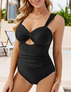 Close-up of black one-piece swimsuit featuring front twist knot and waist ruched details