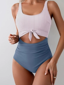Detail of high waisted cutout swimsuit with front knot and pink striped top design