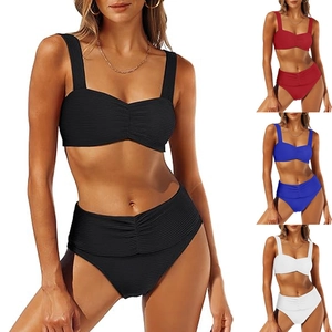 Detail view of ribbed high-waisted bikini sets in black, red, blue, and white colors