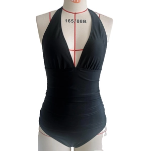 Detail of black one-piece swimsuit with halter deep V-neck and ruched waist on a mannequin