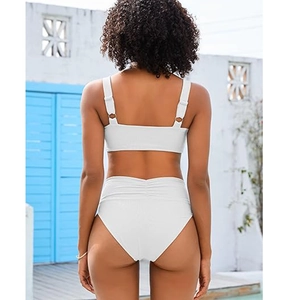 Rear view of white two-piece bikini with high-waisted ribbed fabric and gold buckle detail