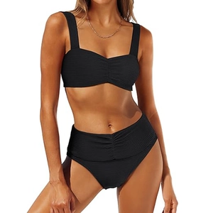 Detail of black ribbed fabric high waist bikini with tummy control shirred texture