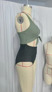 Detail of high waisted bikini with knot front and adjustable straps in olive and black