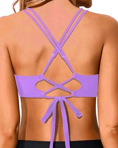 Detail of light purple bikini top featuring multi-cross back straps and adjustable bow tie