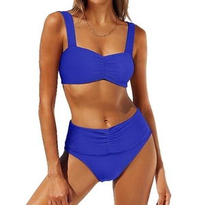 Detail of high waisted blue bikini set with ribbed texture and tummy control ruching