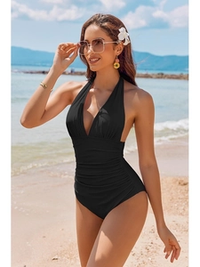 Sexy black one-piece swimsuit with deep V-neck, halter neck, and ruched waist detail